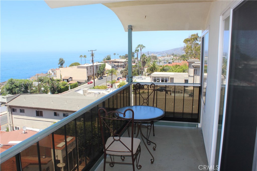 Enjoy spending time on your balcony with panoramic views. - 240 Moss Street 15, Laguna Beach CA 92651 - photo 1
