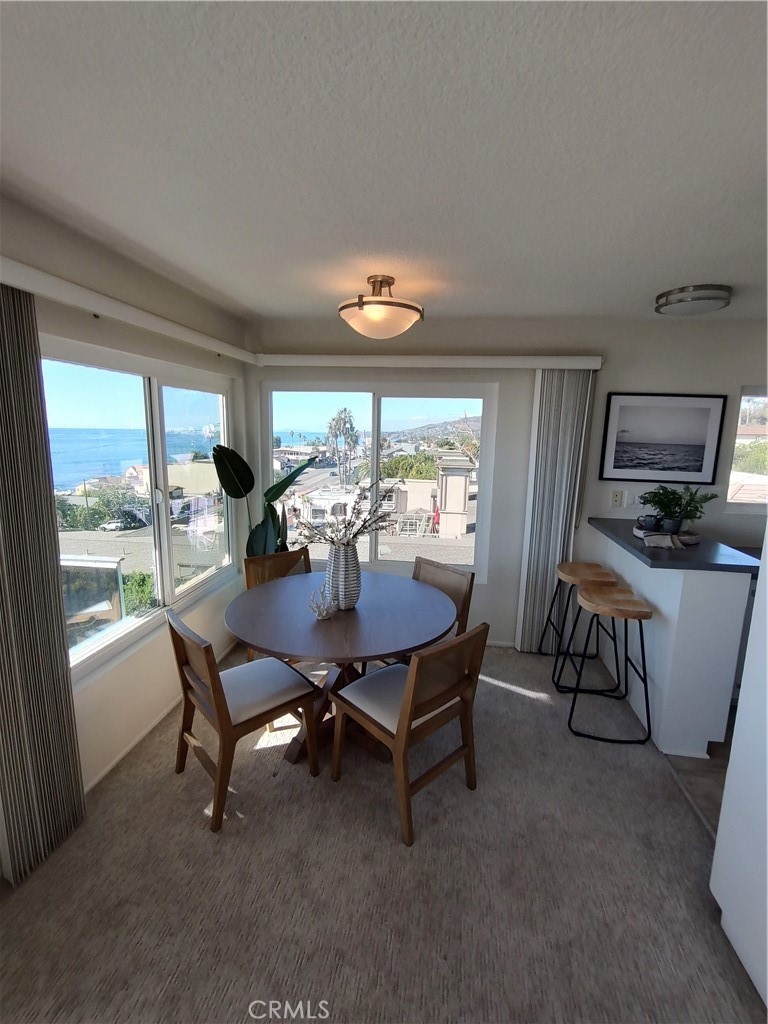 Dining area with ocean views - 240 Moss Street 15, Laguna Beach CA 92651 - photo 12
