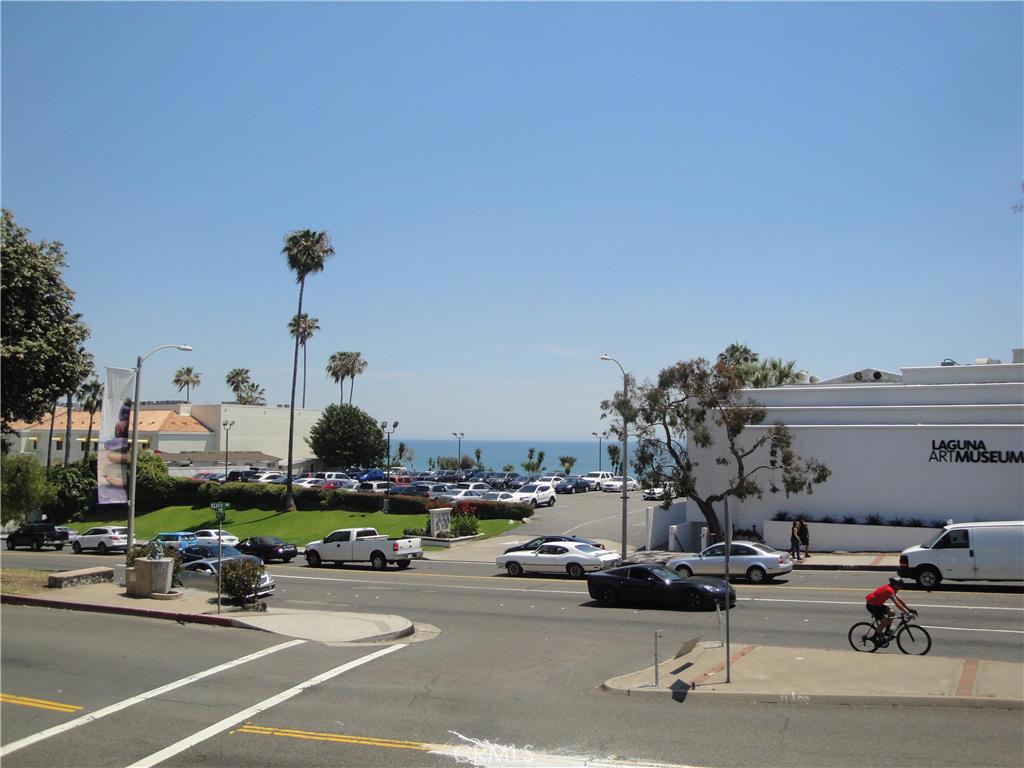 View to the ocean from the patio immediately out your front door. Inn at Laguna on the left and Laguna Art Museum on the - 245 Aster Street 5, Laguna Beach CA 92651 - photo 1