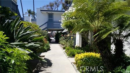 Beautiful gardens surround the home - 245 Aster Street 5, Laguna Beach CA 92651 - photo 1