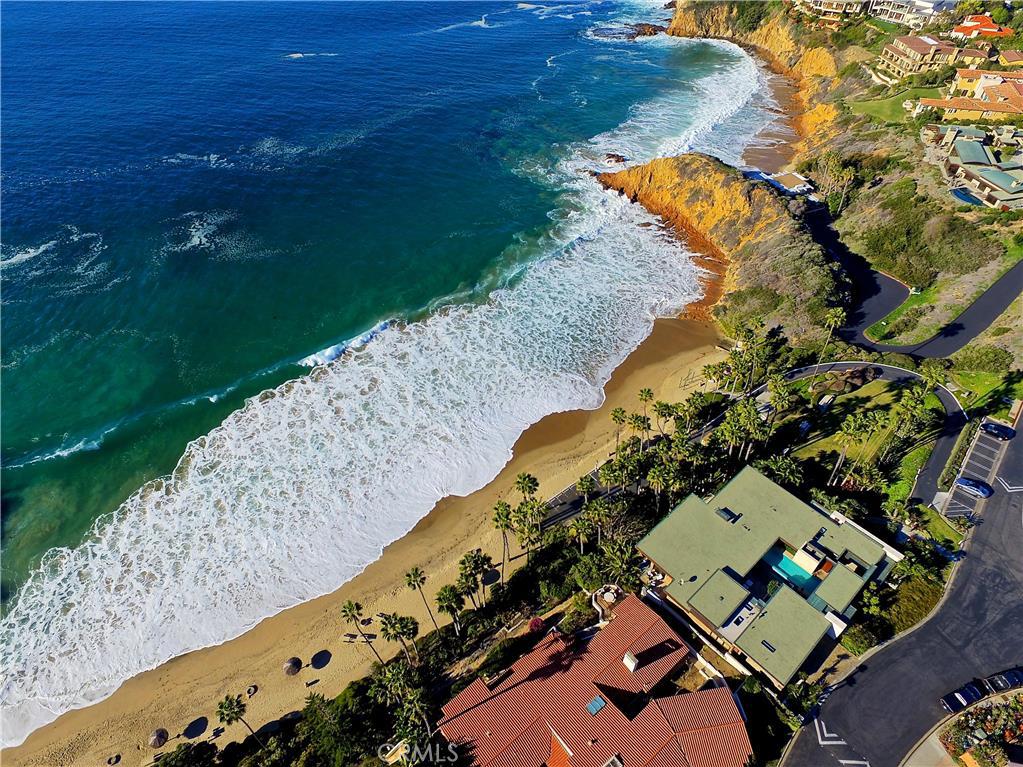 Aerial photography showing private Irvine Cove and home directly in front with the gray roof and pool. - 2495 Riviera Drive, Laguna Beach CA 92651 - photo 1
