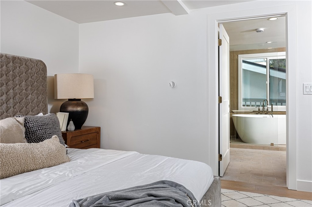 Main house: primary bedroom looking into bath - 251 Highland, Laguna Beach CA 92651 - photo 12