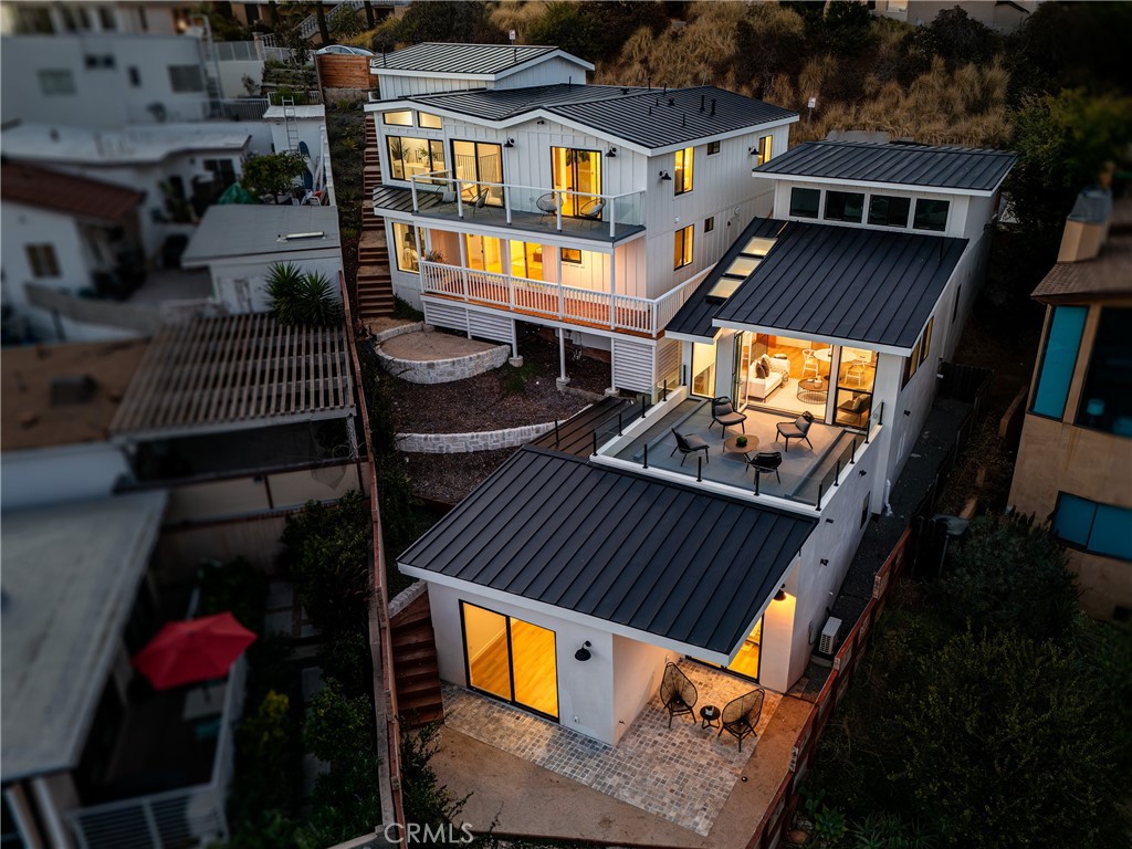 Dusk view of home from ocean side - 251 Highland, Laguna Beach CA 92651 - photo 37