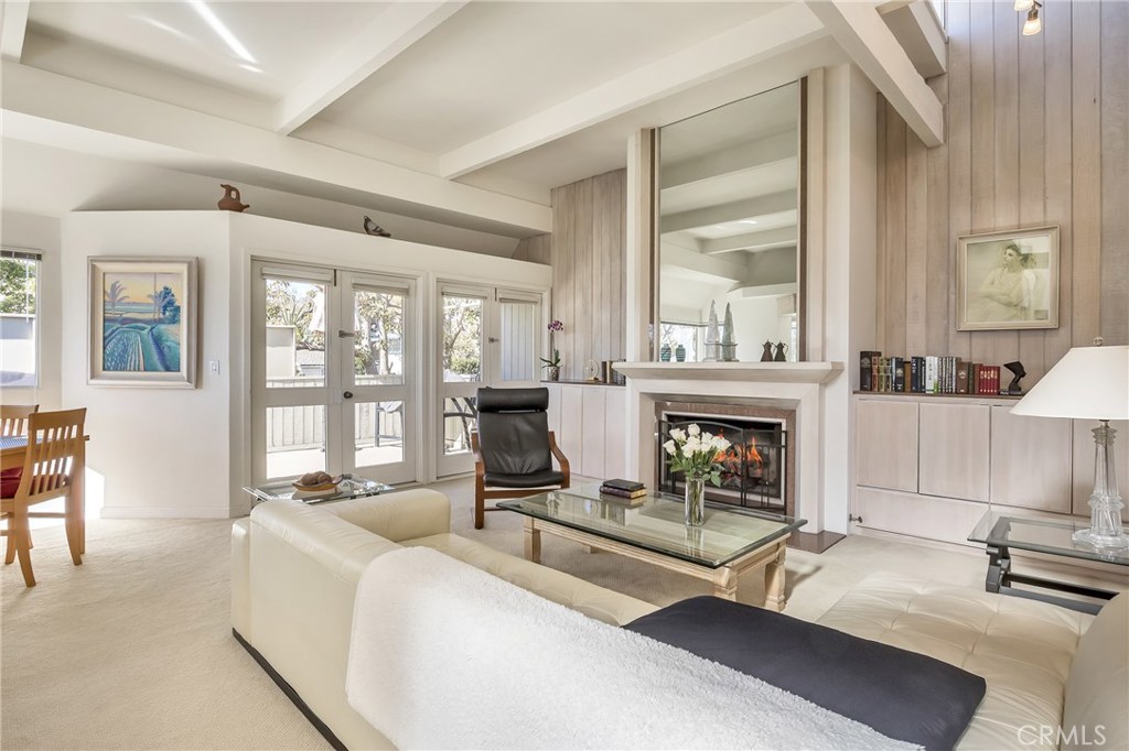 Front unit living room with fireplace and spacious deck. - 253 Fairview Street, Laguna Beach CA 92651 - photo 1