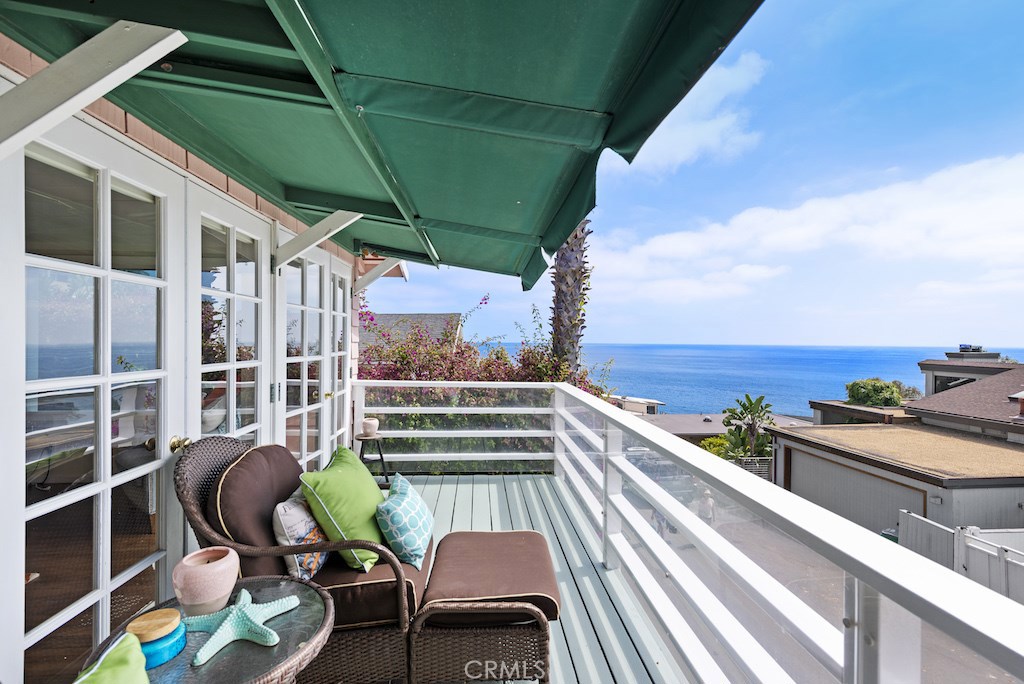 French doors lead fro the living room to the expansive ocean and Catalina Island view deck. - 2618 Victoria Drive, Laguna Beach CA 92651 - photo 1
