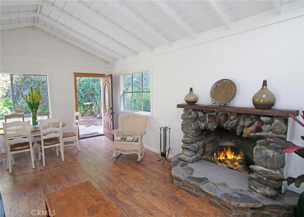 New wood floors throughout the home, freshly painted with a beautiful stone fireplace - 275 Woodland Drive, Laguna Beach CA 92651 - photo 1