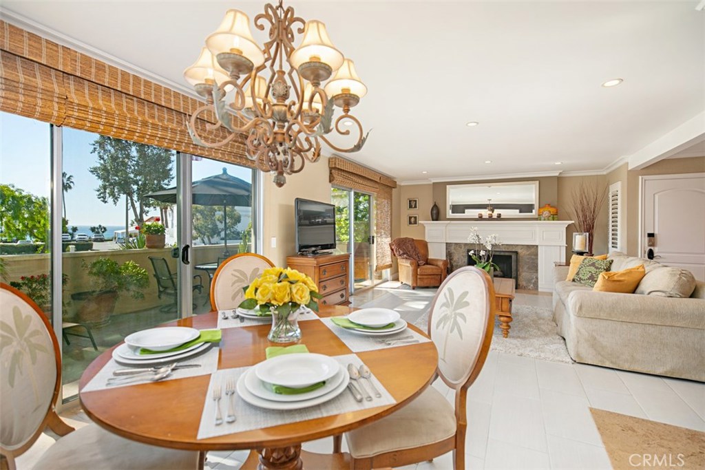 Living Room and Dining Room with ocean views - 280 Cliff Drive 1, Laguna Beach CA 92651 - photo 1