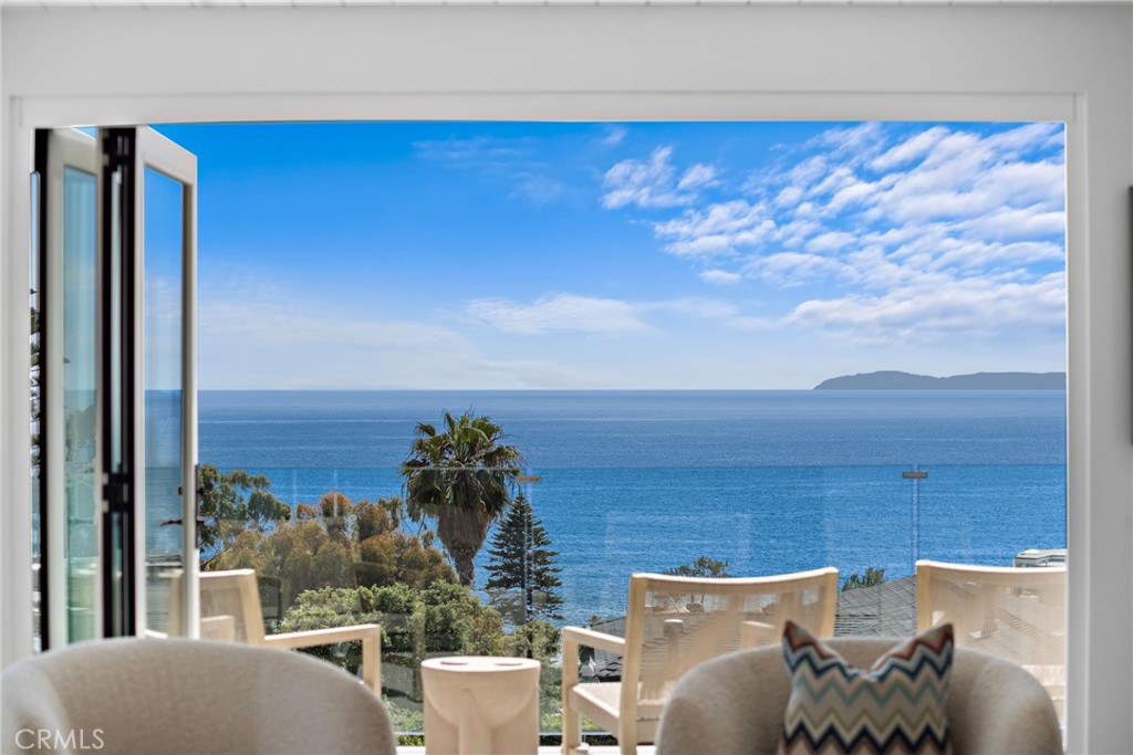 Panoramic ocean views from the living room, kitchen, and dining area. - 2845 Rounsevel, Laguna Beach CA 92651 - photo 1