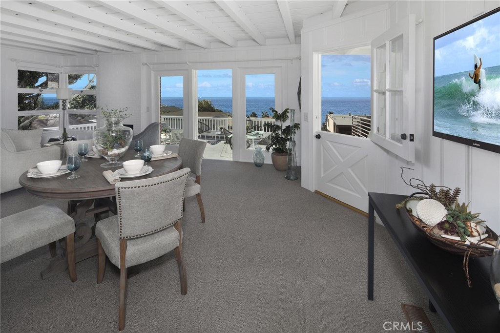 LIVING AND DINING AREA OPENS TO LARGE DECK - 2856 Rounsevel Terrace, Laguna Beach CA 92651 - photo 1