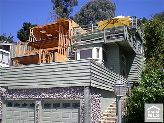 SUBJECT PROPERTY WITH NEW HOME BEING BUILT NEXT DOOR - 2882 ALEXANDER, Laguna Beach CA 92651 - photo 1