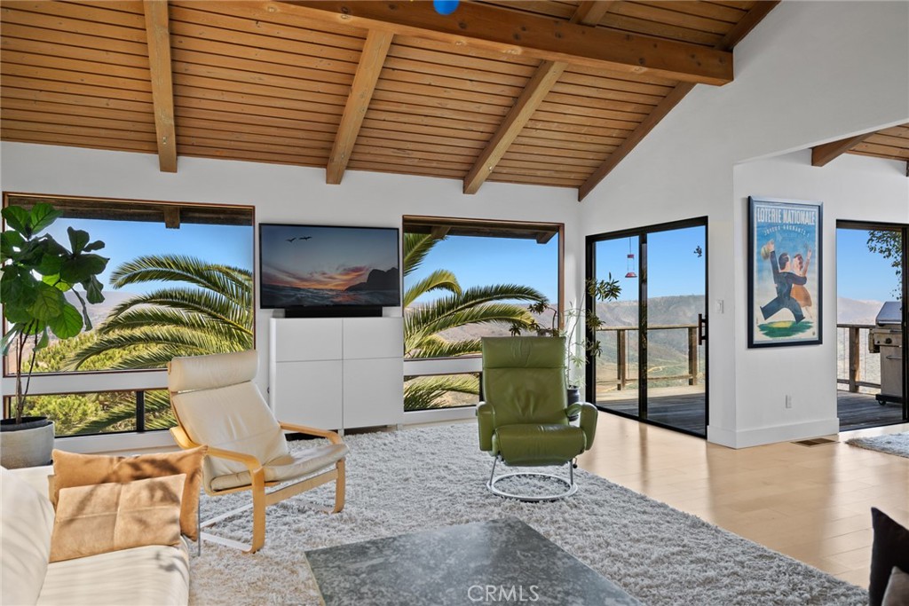 Numerous windows, including picture and clerestory, take full advantage of the four-bedroom, three- and one-half-bath de - 28862 Top of the World Drive, Laguna Beach CA 92651 - photo 1