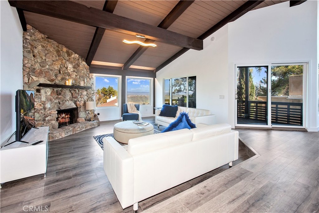 Great room with city lights & access to the deck. - 28871 Top Of The World Drive, Laguna Beach CA 92651 - photo 1