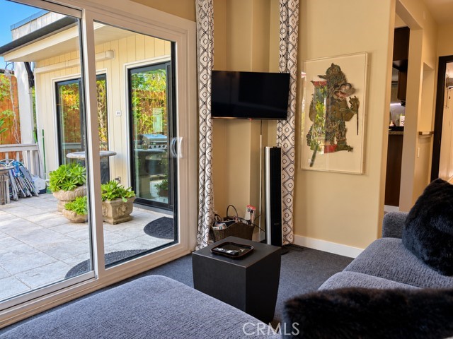 The den features a beautiful view of the garden. - 2948 S Coast Highway, Laguna Beach CA 92651 - photo 22