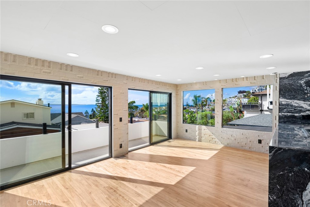 Living room with direct access to ocean view deck - 2966 Terry, Laguna Beach CA 92651 - photo 3