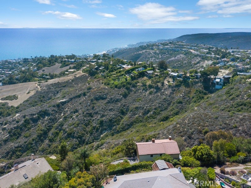 Aerial from behind, home in lower center, with stunning views - 2985 Zurich Court, Laguna Beach CA 92651 - photo 1