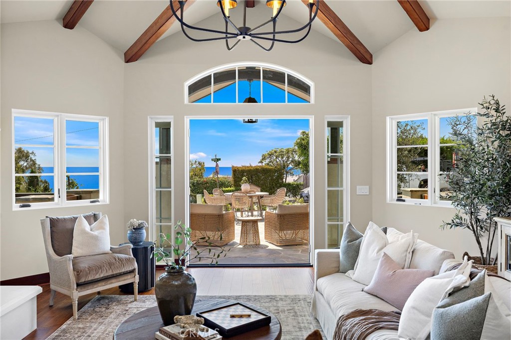 French doors lead from the living room to the front patio with breathtaking views, creating an inviting connection betwe - 3002 Dorn Court, Laguna Beach CA 92651 - photo 6