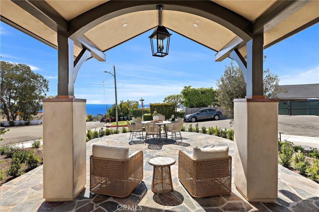 Expansive covered front patio for easy indoor,outdoor living. - 3002 Dorn Court, Laguna Beach CA 92651 - photo 7