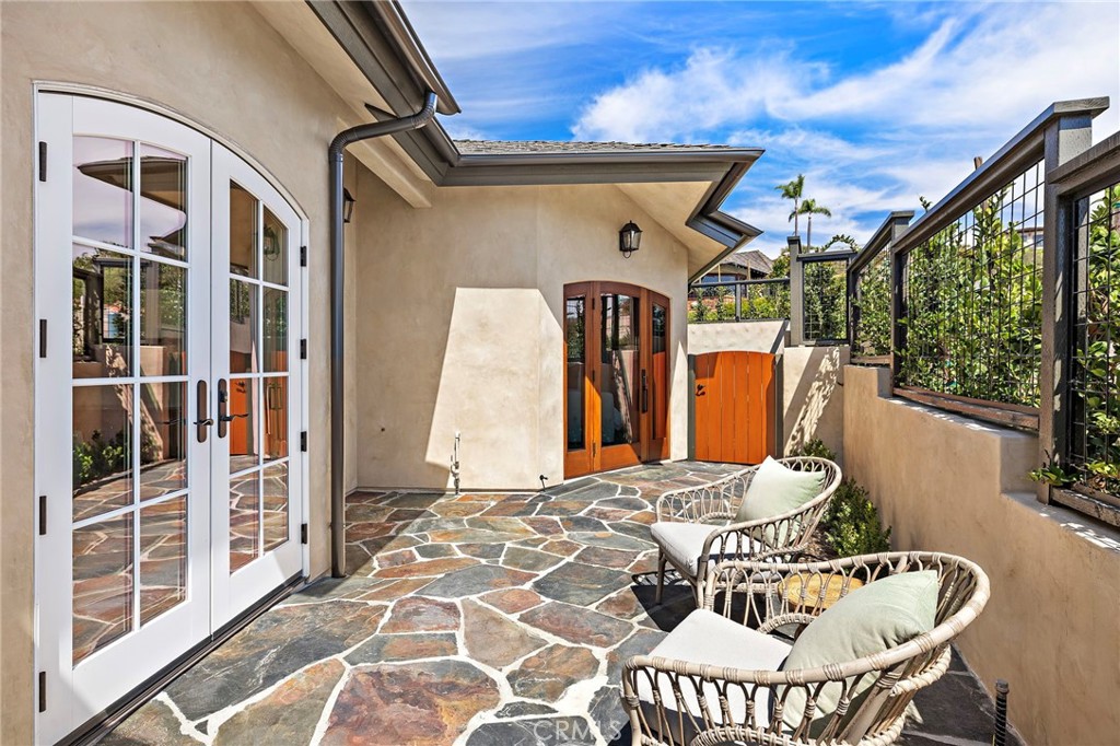 Door from the primary suite leads to an exterior sitting area. - 3002 Dorn Court, Laguna Beach CA 92651 - photo 17