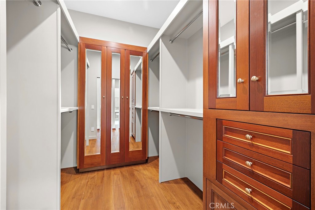 Primary walk-in closet finished in reclaimed Honduras Mahogany - 3002 Dorn Court, Laguna Beach CA 92651 - photo 18