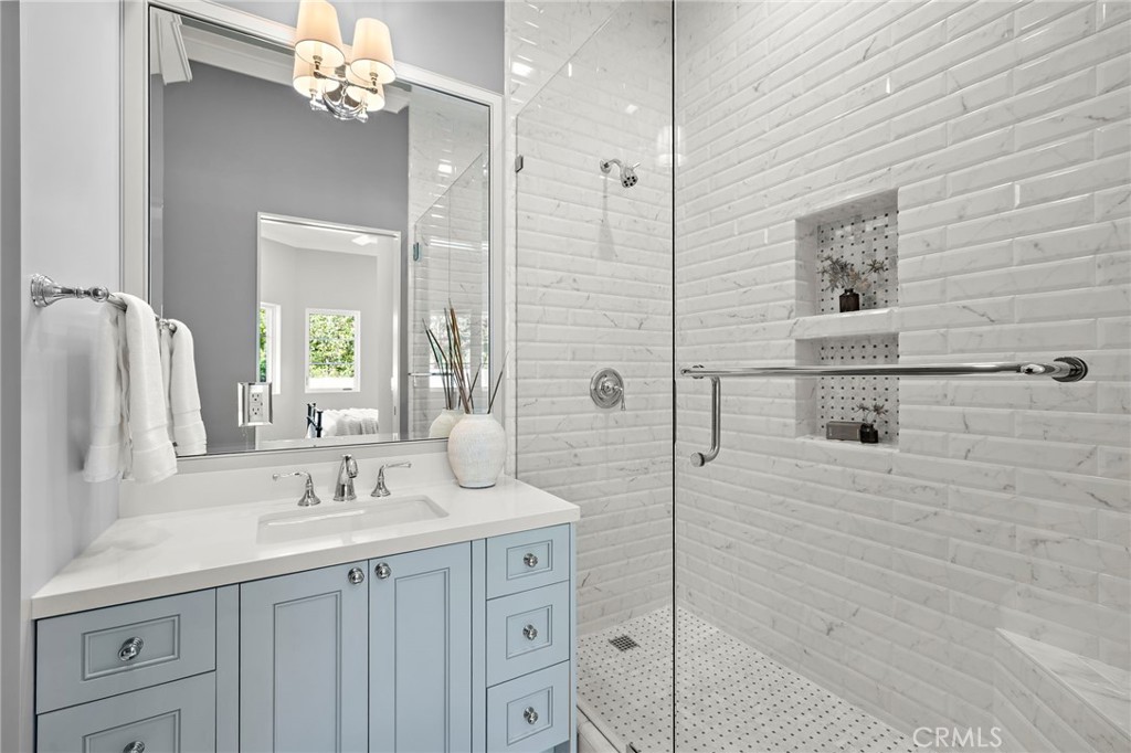 En-suite bath to guest bedroom one with Toto toilet, Phylrich faucets, and white Quartz countertops. Shower features Car - 3002 Dorn Court, Laguna Beach CA 92651 - photo 23