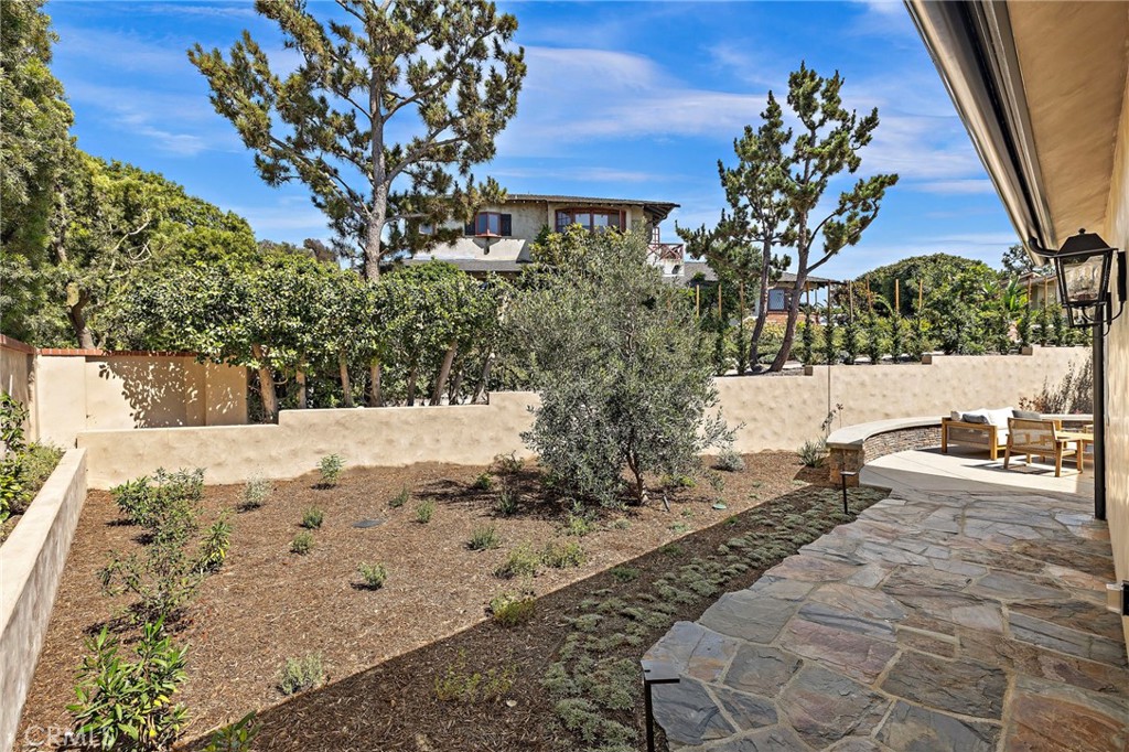 Backyard and back patio area is fully fenced, landscaped, and hardscaped. - 3002 Dorn Court, Laguna Beach CA 92651 - photo 29