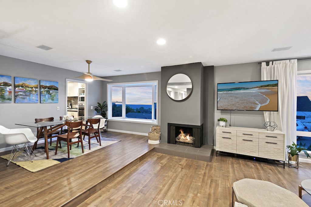 Breathtaking views can be enjoyed from both the living room and dining room. - 3034 Bern Drive, Laguna Beach CA 92651 - photo 1