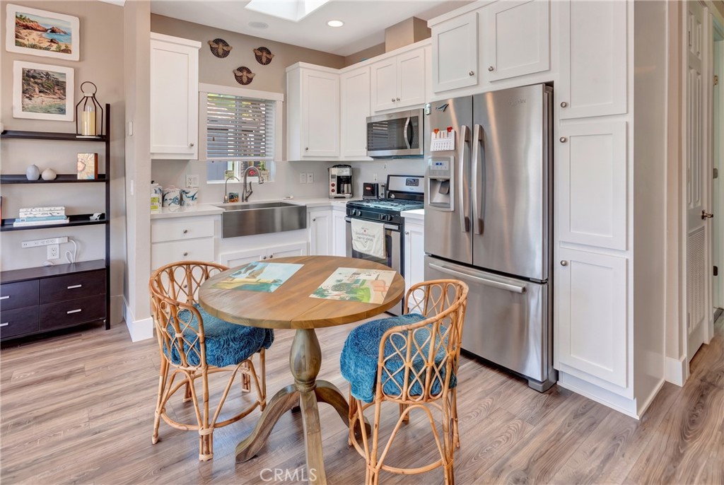Kitchen features high ceiling and skylight. - 30802 Coast F25, Laguna Beach CA 92651 - photo 7