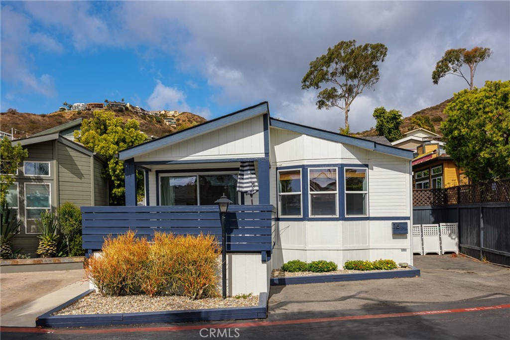 Lovely curb appeal and large deck for outdoor living and dining. - 30802 Coast Highway D16, Laguna Beach CA 92651 - photo 1