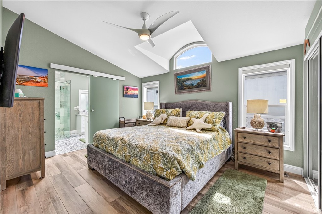 Primary bedroom with view of bathroom - 30802 S Coast Highway F-10, Laguna Beach CA 92651 - photo 13