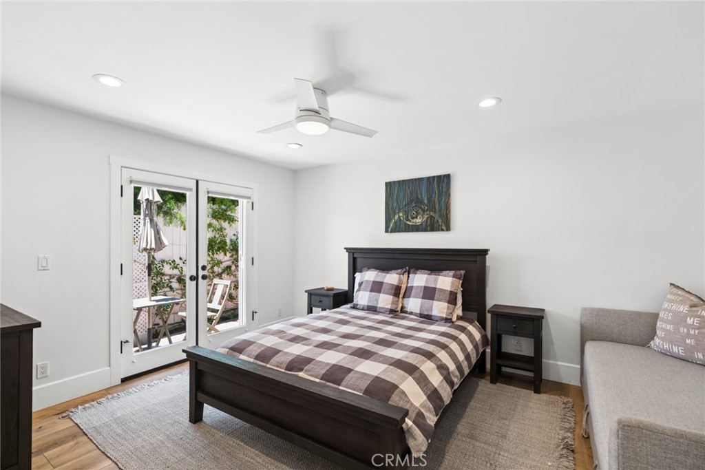 Two additional bedrooms open through French doors to a secluded patio with an above ground spa and outdoor shower, the p - 31012 Aliso Circle, Laguna Beach CA 92651 - photo 20