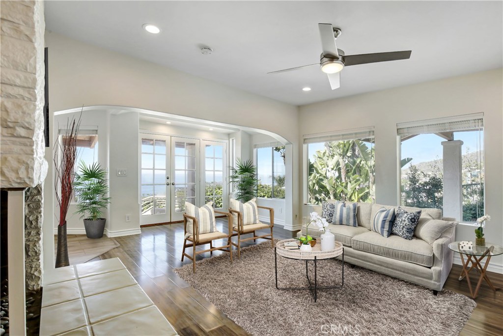 Tranquil and bright living room with coastline views of Aliso Creek Beach - 31122 Brooks Street, Laguna Beach CA 92651 - photo 10