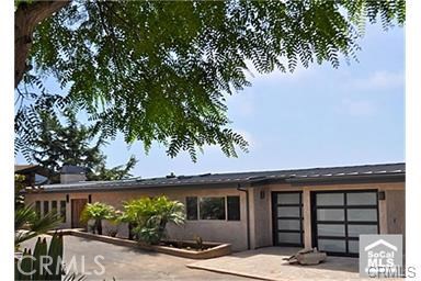 Photo of front of main house. Property has three levels with main house occupying the first two levels and the studio ap - 31341 Ceanothus Drive, Laguna Beach CA 92651 - photo 1