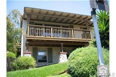 Front of dwelling showing lower level bedroom & bath and the generous front porch. - 31471 Monterey Street, Laguna Beach CA 92651 - photo 1
