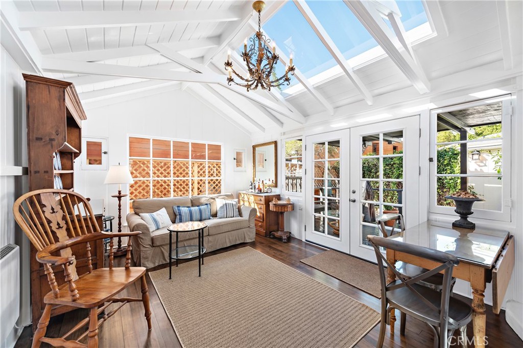 Living room with newer retractable skylights. French doors open onto the covered deck. - 31521 Summit Road, Laguna Beach CA 92651 - photo 9