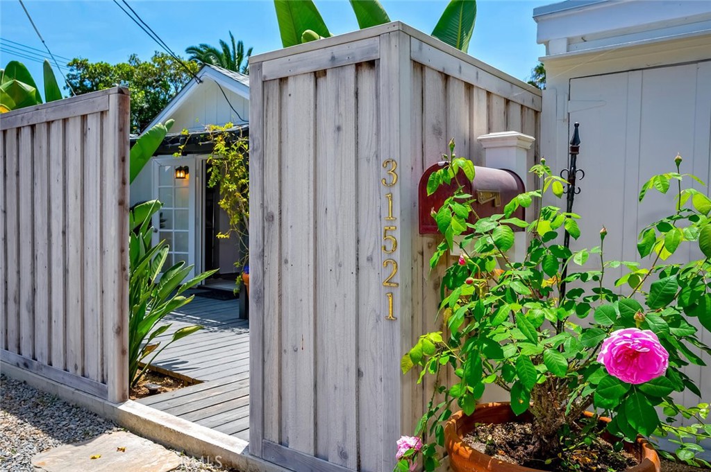 The property is fully enclosed with a newer gate. Three spaces along the fence for parking. - 31521 Summit Road, Laguna Beach CA 92651 - photo 35