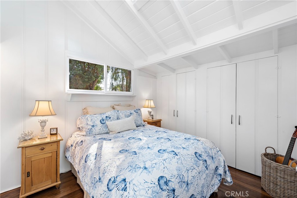 Bedroom in the main cottage with wood floors, high pitched beamed ceilings, and ample closet space. - 31521 Summit Road, Laguna Beach CA 92651 - photo 13