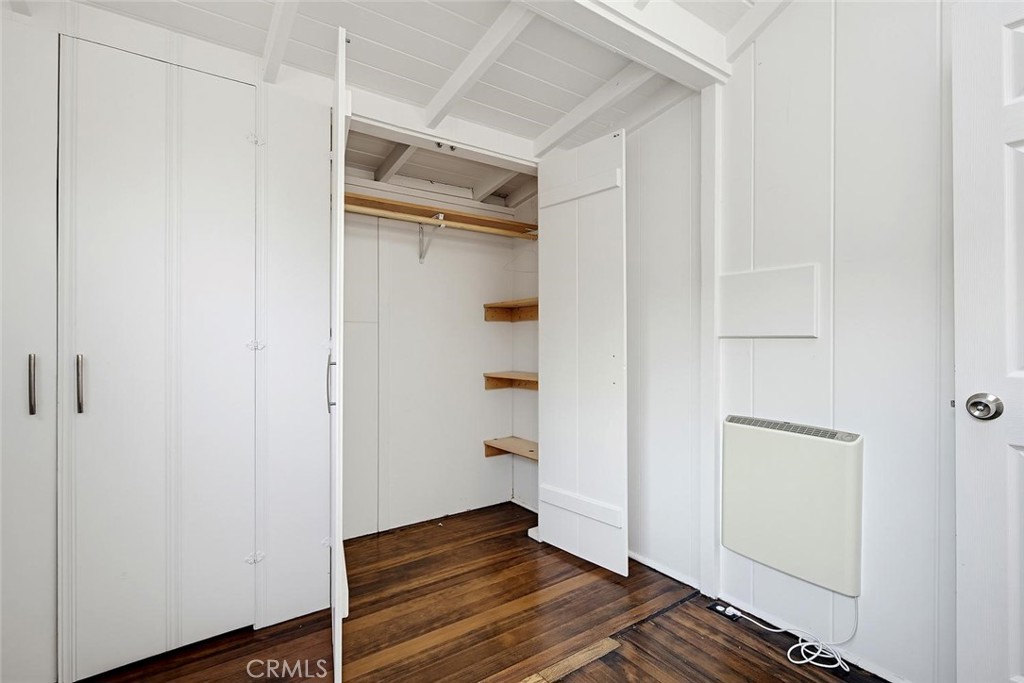 Closet in the primary bedroom with both hanging rods and shelves for organization. - 31521 Summit Road, Laguna Beach CA 92651 - photo 22