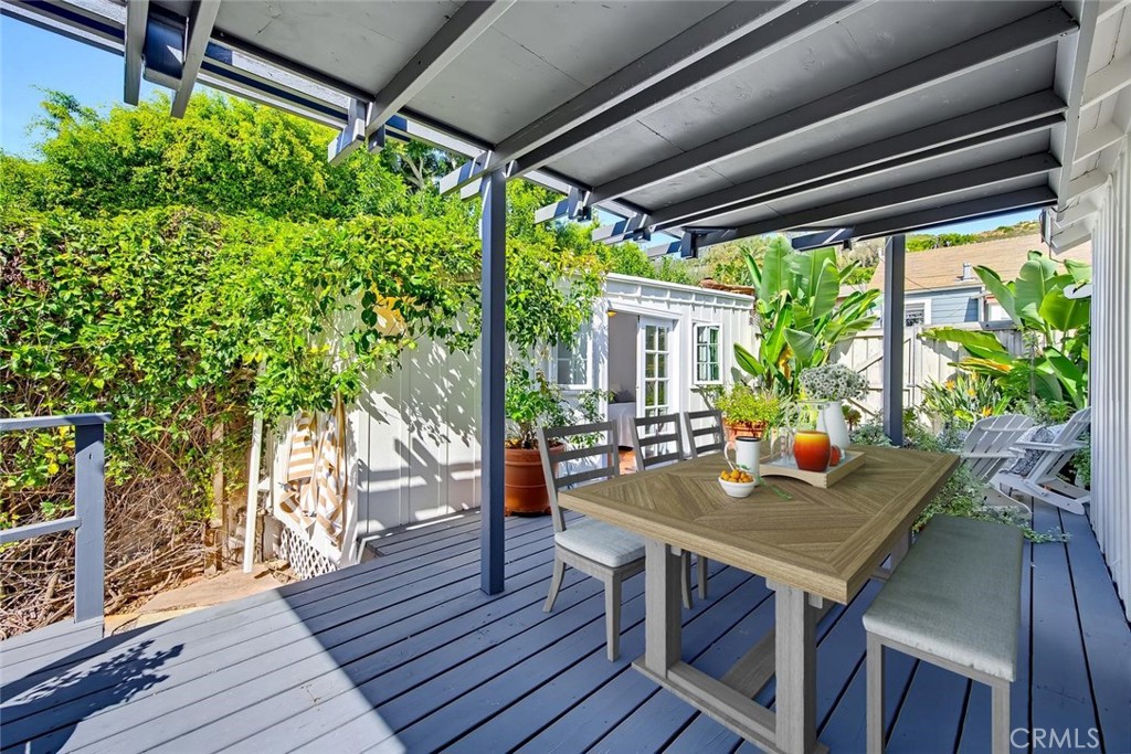 Enjoy outdoor dining on the covered deck. - 31521 Summit Road, Laguna Beach CA 92651 - photo 24