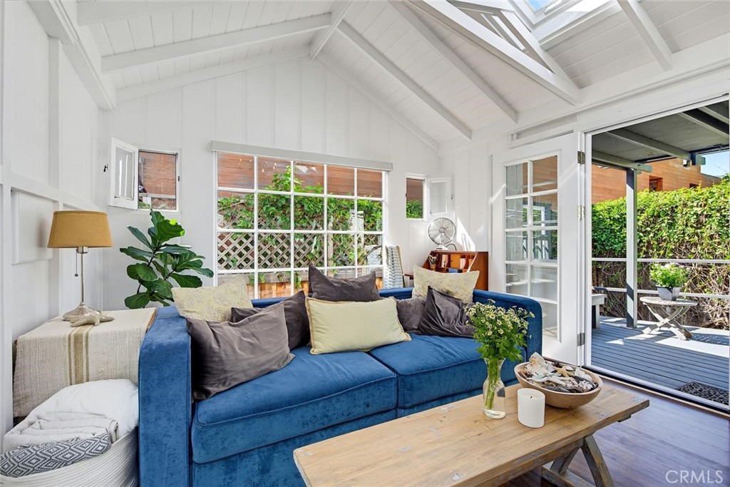 Light and bright living room with sun filled windows and French doors. - 31521 Summit Road, Laguna Beach CA 92651 - photo 13