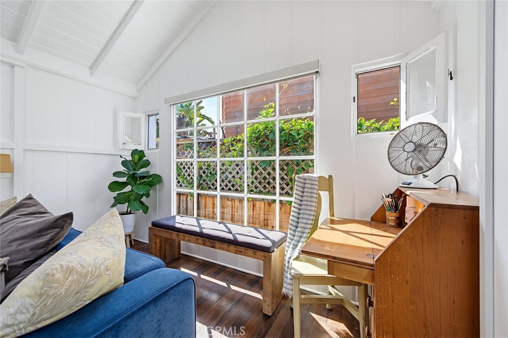Behind the couch is more space for a desk and seating under the light filled window. - 31521 Summit Road, Laguna Beach CA 92651 - photo 14