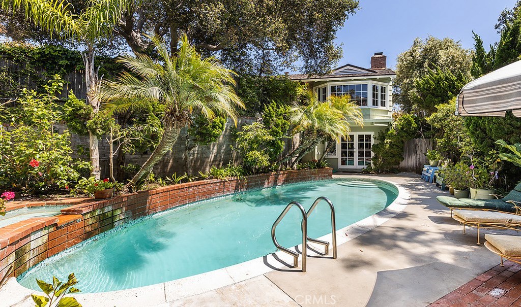 Enjoy privacy in this lush backyard with this mid-century style swimming pool, spa, waterfall, gas fire pit and mountain - 31553 West Street, Laguna Beach CA 92651 - photo 1