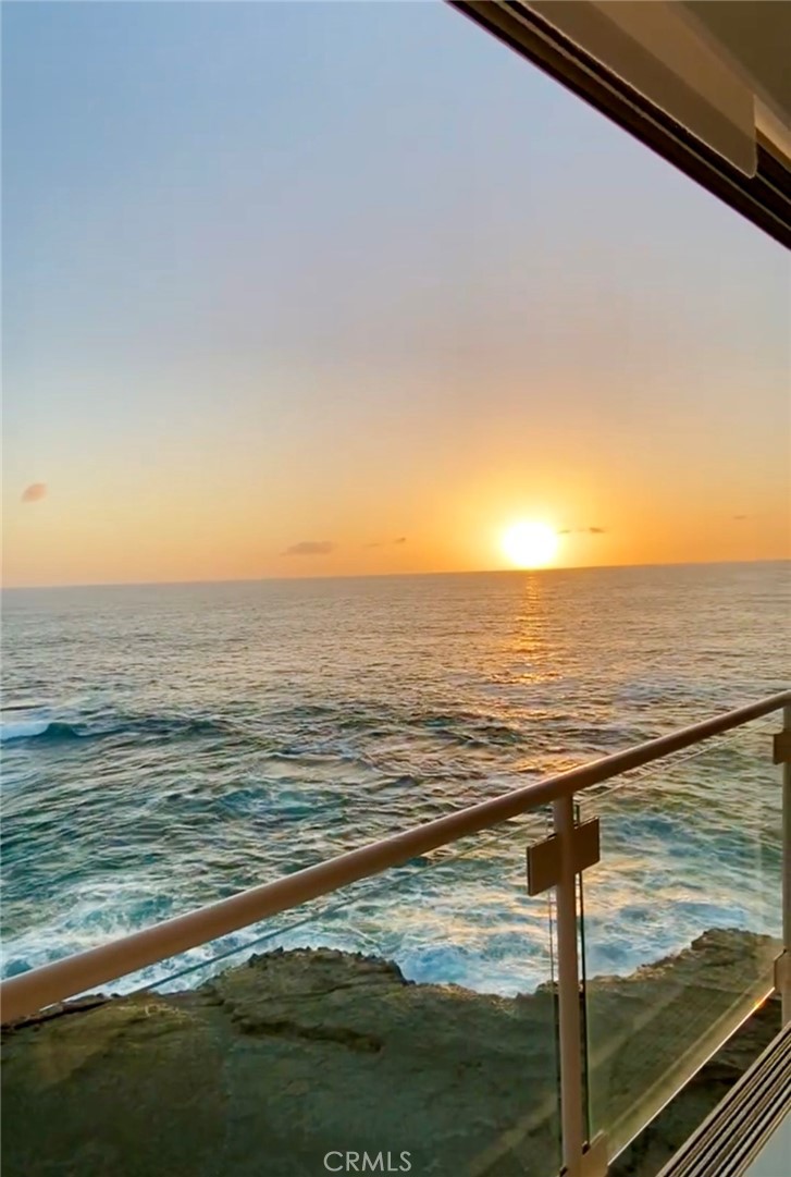 Main bedroom with sunset views over the ocean - 31561 Table Rock Drive 105, Laguna Beach CA 92651 - photo 19
