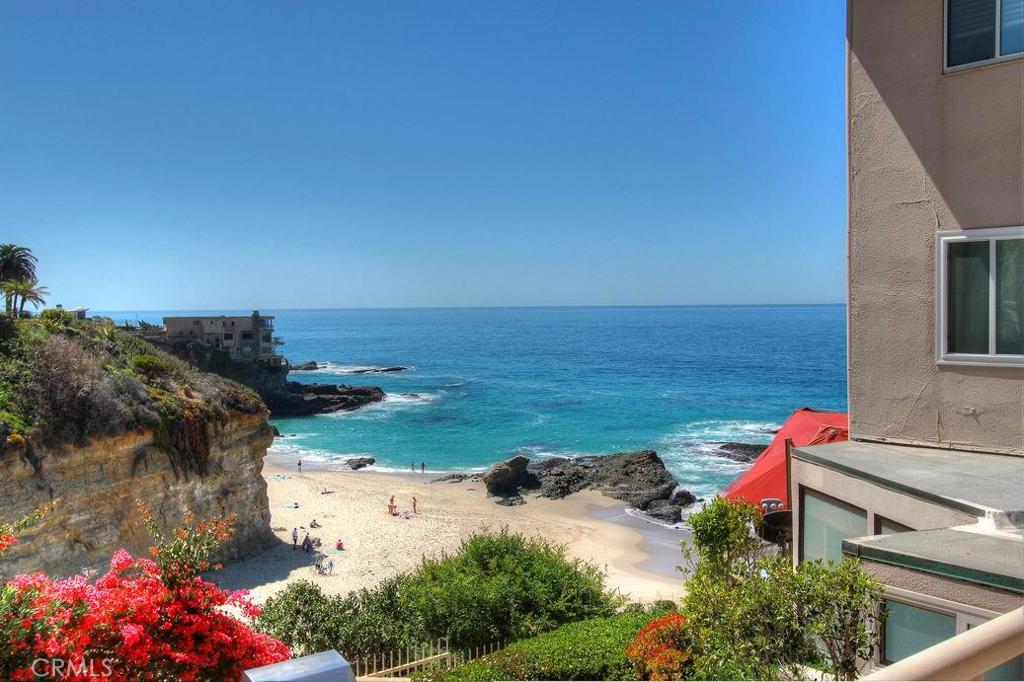 View of ocean, bluffs, beach, and rock outcroppings from this condo's oversized private deck. - 31561 Table Rock Drive 214, Laguna Beach CA 92651 - photo 1