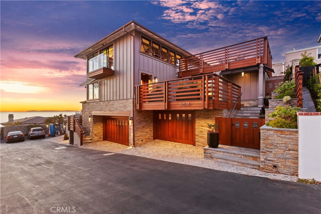 Two levels of living space above a 3-car garage on an elevated, oceanfront adjacent lot overlooking the ocean. - 31678 Seacliff Drive, Laguna Beach CA 92651 - photo 1
