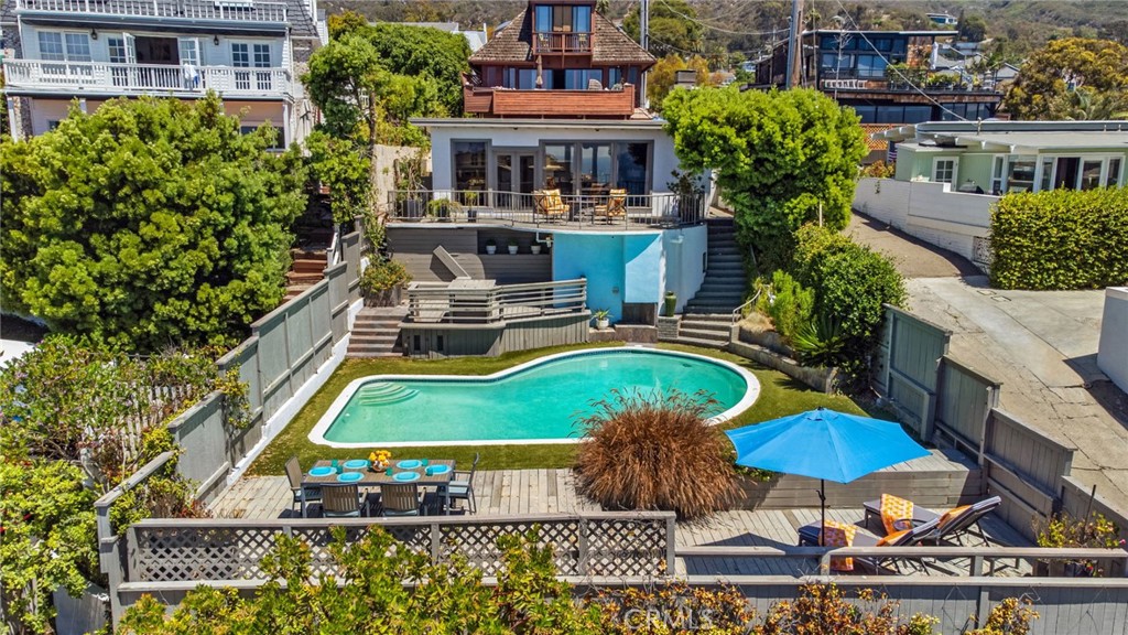 View of private swimming pool, expansive multi-level outdoor living areas, spacious decks for dining and lounging, matur - 31731 Seacove, Laguna Beach CA 92651 - photo 11