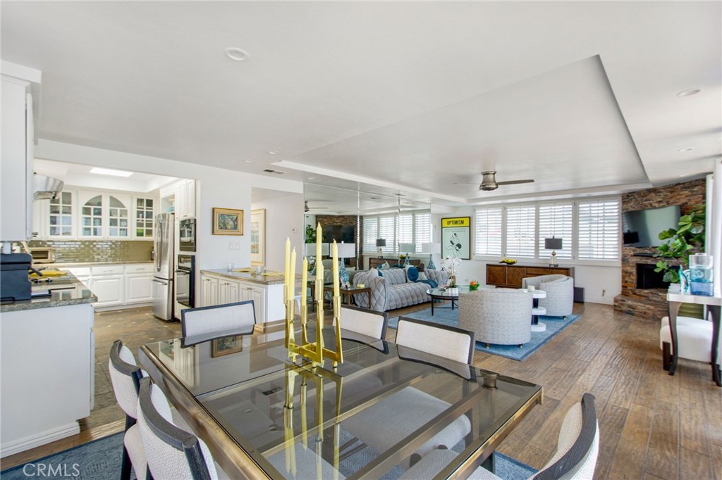 Panoramic view capturing open kitchen, dining and living room space. - 31731 Seacove, Laguna Beach CA 92651 - photo 27