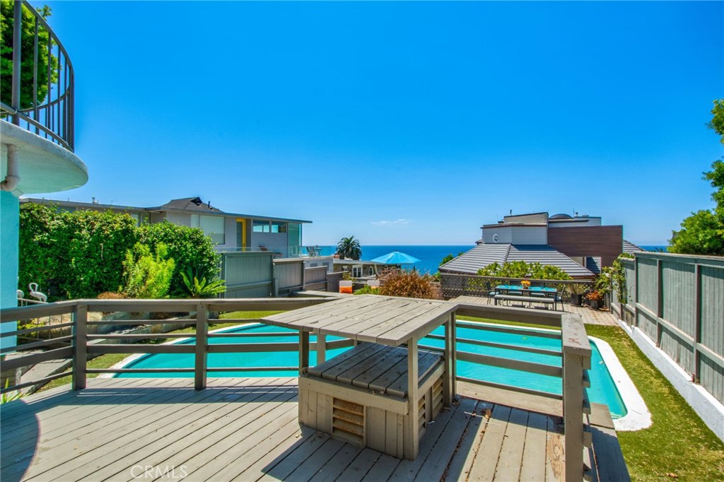 Direct view from lower deck towards private pool, outdoor dining and entertaining area and ocean views. - 31731 Seacove, Laguna Beach CA 92651 - photo 60
