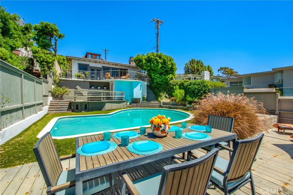 Lower deck area featuring a private swimming pool, spacious multi-level deck, lounge and dining areas. - 31731 Seacove, Laguna Beach CA 92651 - photo 61
