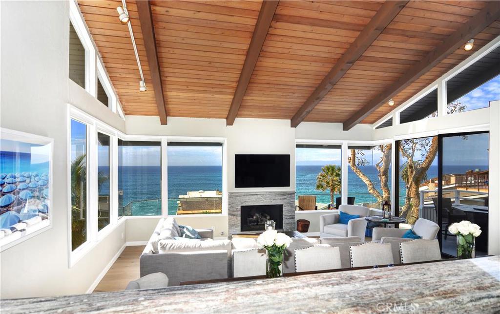 Living Room and Kitchen - "50 yard line" sit down view of the seasonal migration of whales. - 31735 Seacliff Drive, Laguna Beach CA 92651 - photo 1