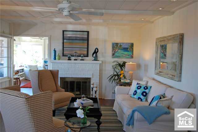Living room with beamed ceilings & fireplace - 31897 9TH Avenue, Laguna Beach CA 92651 - photo 1